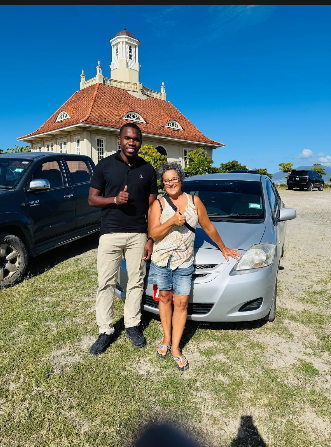 Customers with their HG rental car in St. Kitts